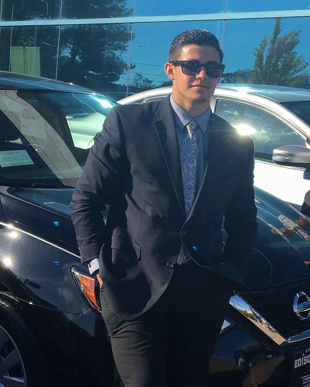 Charlie at his first car sales job